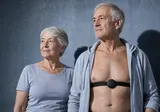Older couple wearing Aidlab during exercise